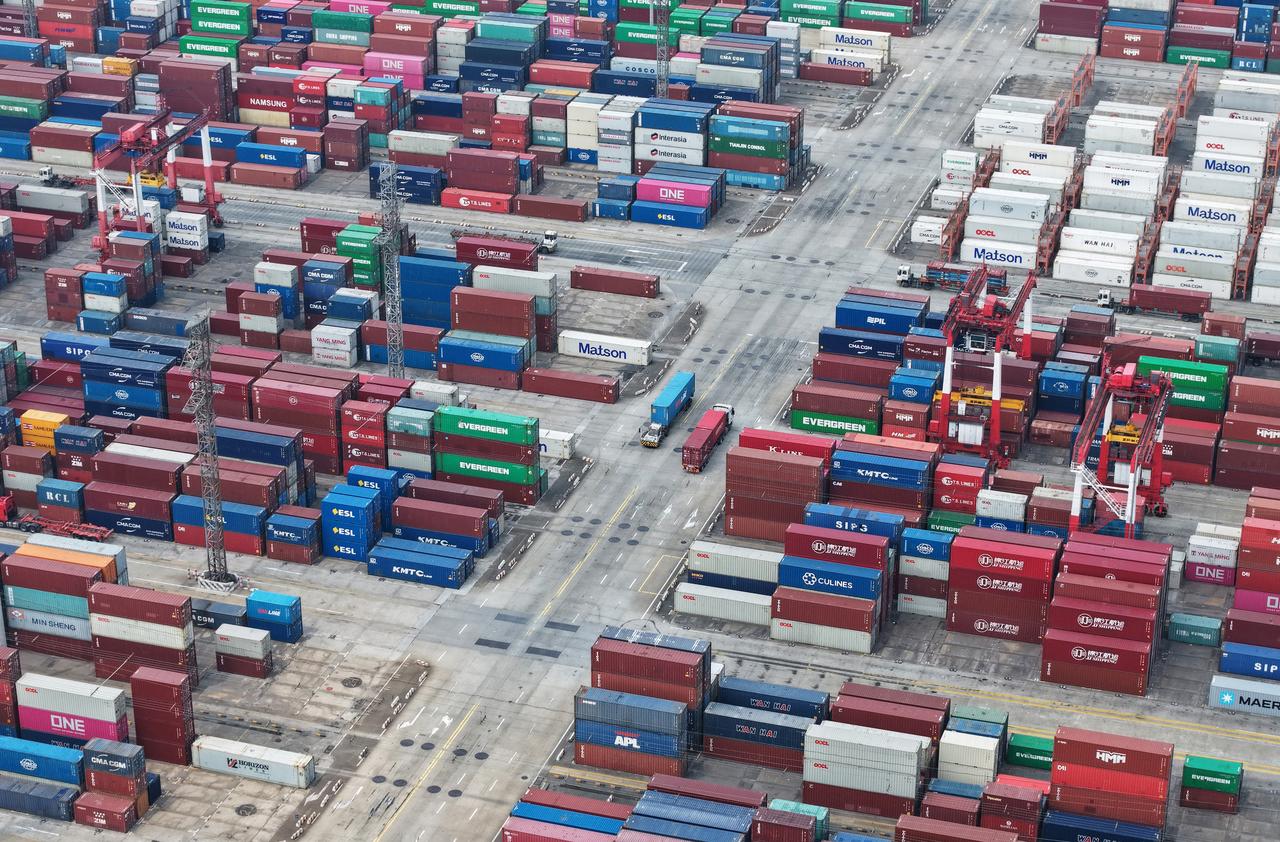 Shipping containers are stacked at a port in Shanghai on June 9, 2025. (AFP Photo)