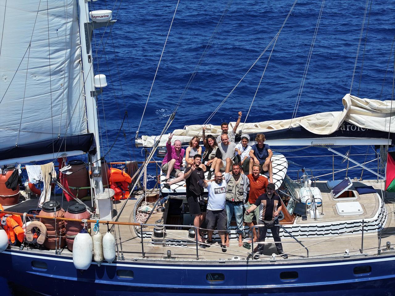 The sailboat named “Madleen” and the activists on it, which set out to break the blockade against Gaza and bring humanitarian aid to Palestinians struggling with hunger under Israeli attacks on 8 June, 2025. (AA Photo)