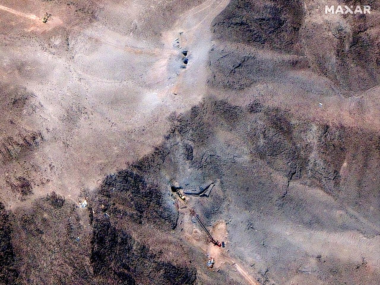 This handout satellite image provided by Maxar Technologies and dated June 29, 2025 shows a close view of activity at the ventilation shaft at the Fordo (Fordow) Fuel Enrichment Plant complex, about 30 kilometres north of Qom in central Iran. (Photo by Satellite image ©2025 Maxar Technologies / AFP)