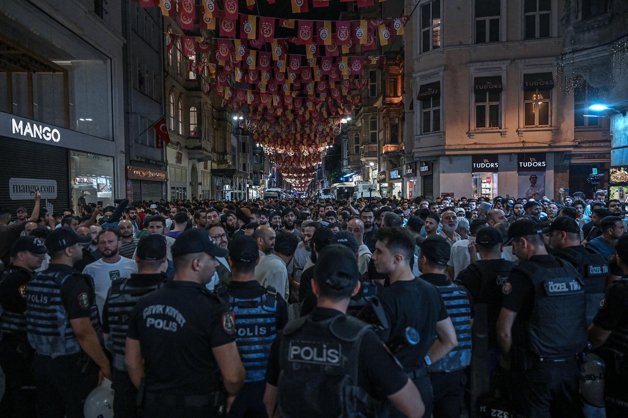 People shout slogans against cartoonists as they gather near so-called Turkish satirical magazine Leman in Istanbul on June 30, 2025. (AFP Photo)