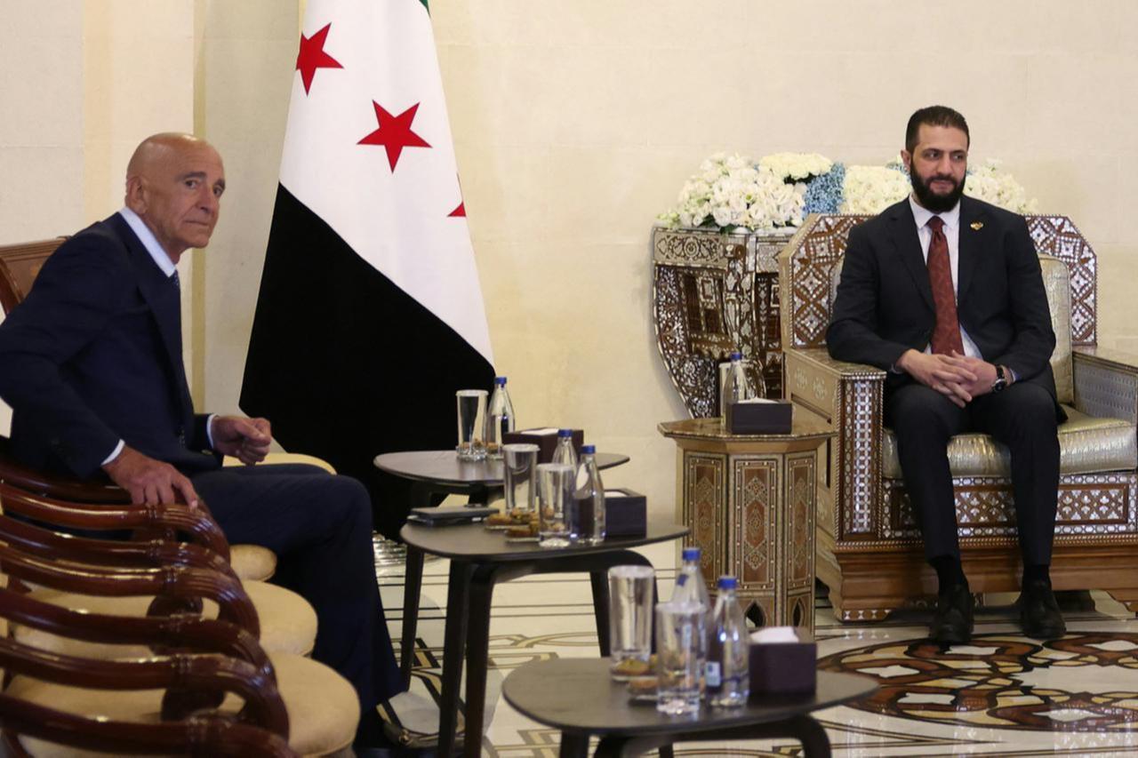 Syrias President Ahmad al-Sharaa (R) receives US Special Envoy to Syria and Ambassador to Türkiye Thomas Barrack, at the presidential palace in Damascus on July 9, 2025. (AFP Photo)