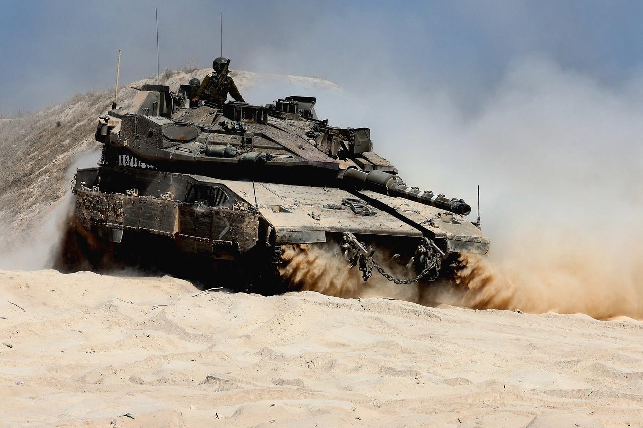An Israeli tank drives into position near the border with the Gaza Strip on July 8, 2025. (AFP Photo)