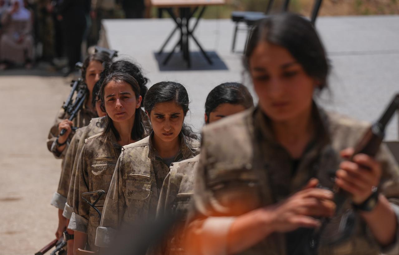 The first group of PKK terrorists lays down and destroys their weapons in Sulaymaniyah, northern Iraq on July 11, 2025. (AA Photo)
