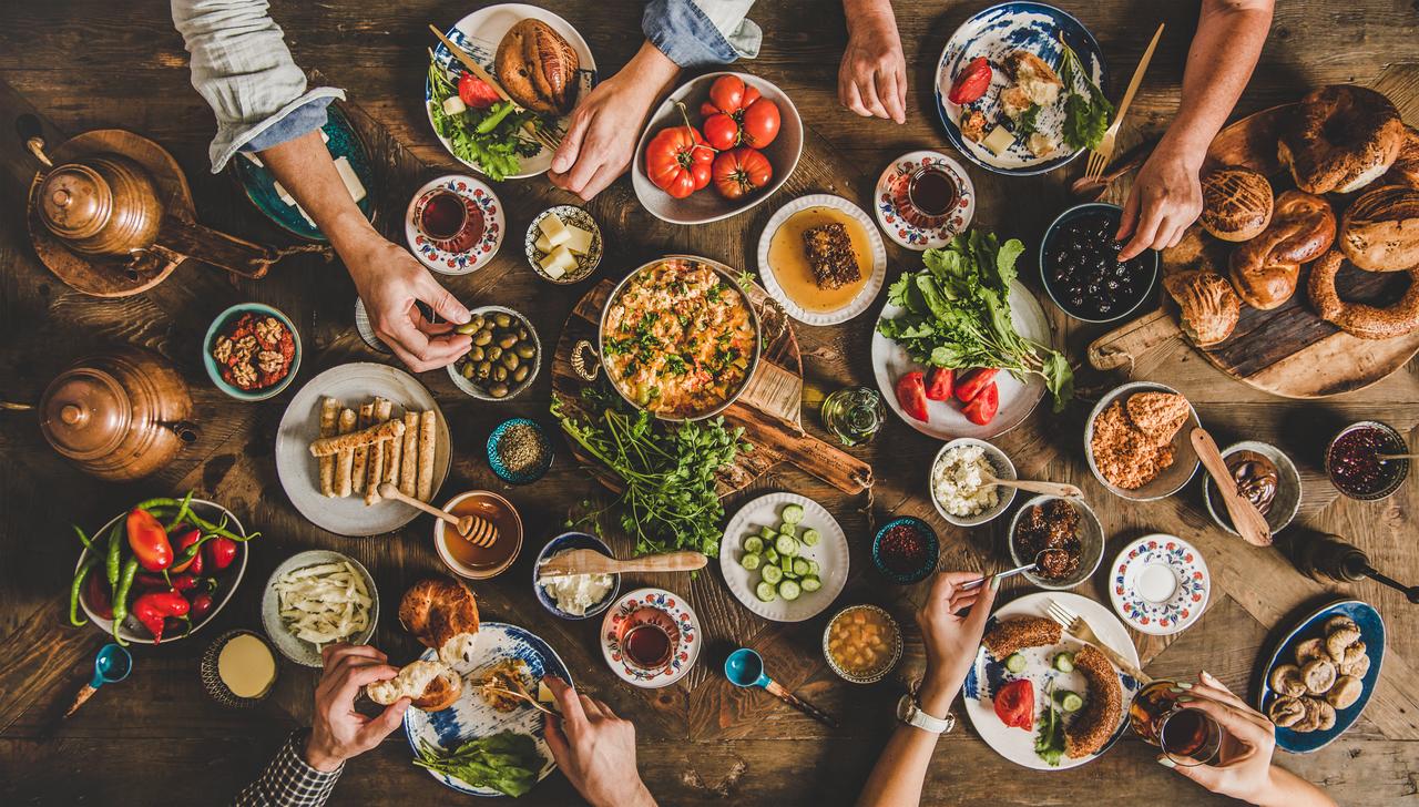 People share a traditional Turkish breakfast spread at a communal table, in Türkiye. (Adobe Stock Photo)