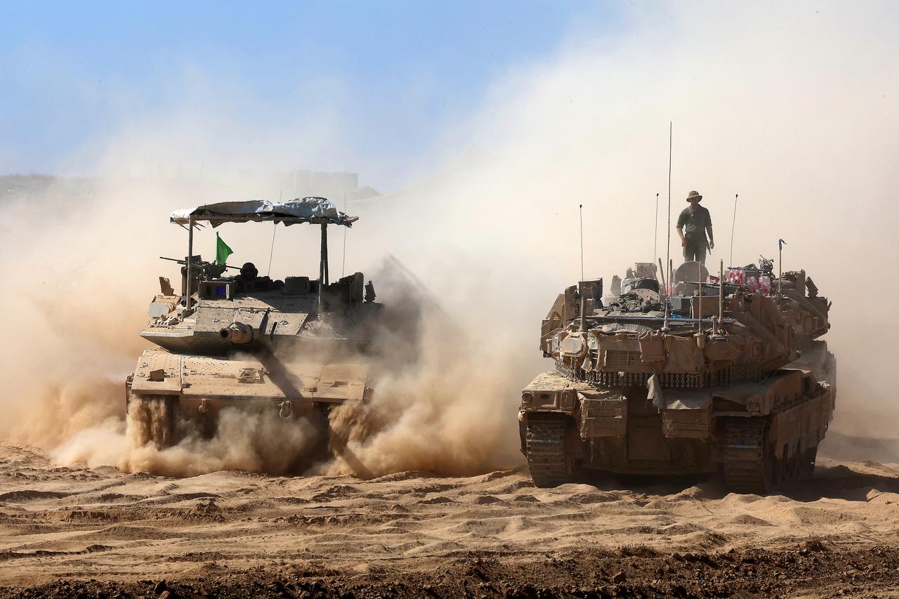 Israeli troops deploy by Israel's border fence with the Gaza Strip on July 10, 2025. (AFP Photo)