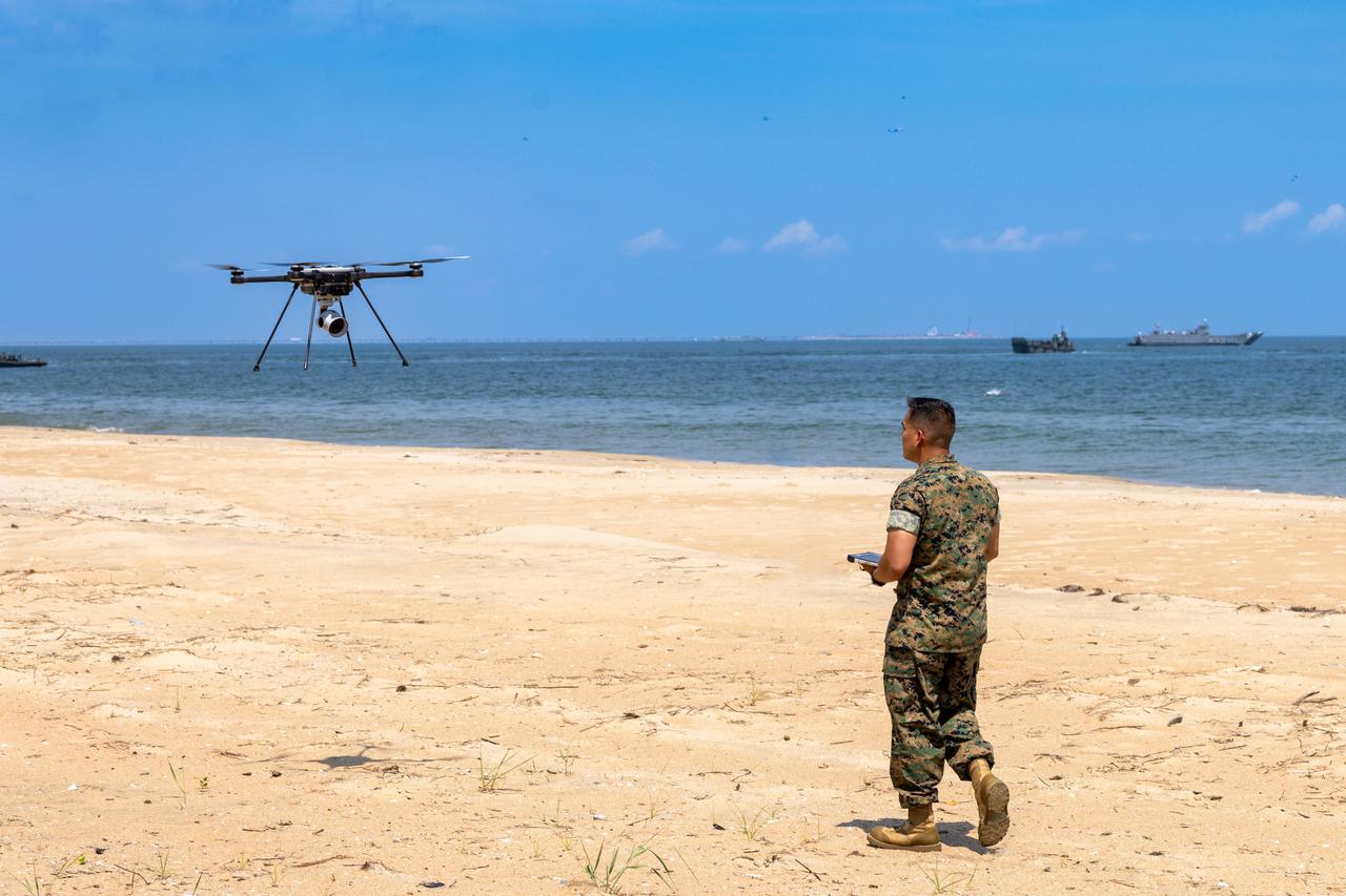 Marine Corps pilots a small unmanned aircraft system at Joint Expeditionary Base Little Creek–Fort Story, Virginia, U.S., June 30, 2025. (Photo via U.S. Marine Corps)