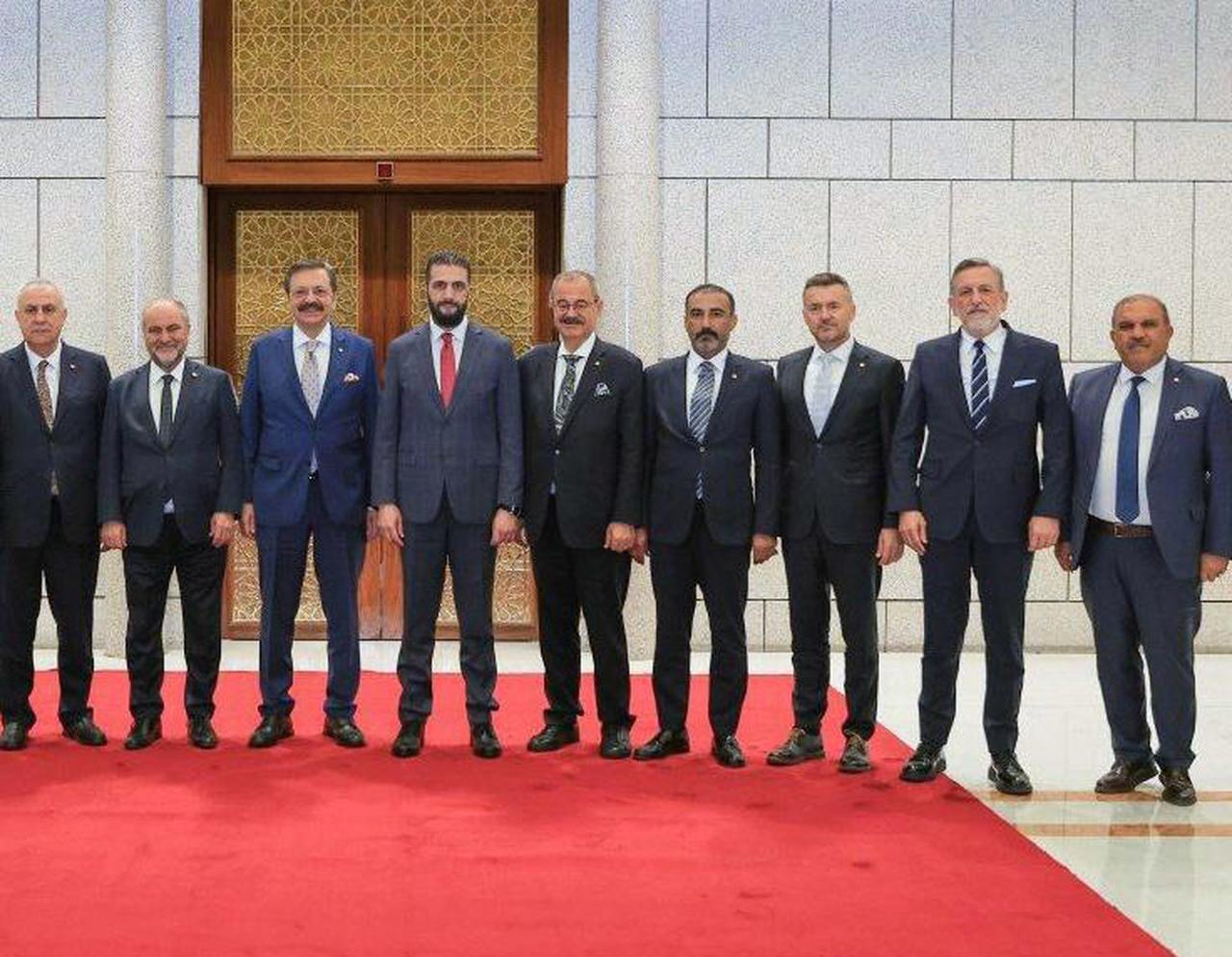 TOBB President Rifat Hisarciklioglu (third from left) meets with Syrian President Ahmed Shar’a (fourth from left) in Damascus, Syria, on July 10, 2025. (AA Photo)