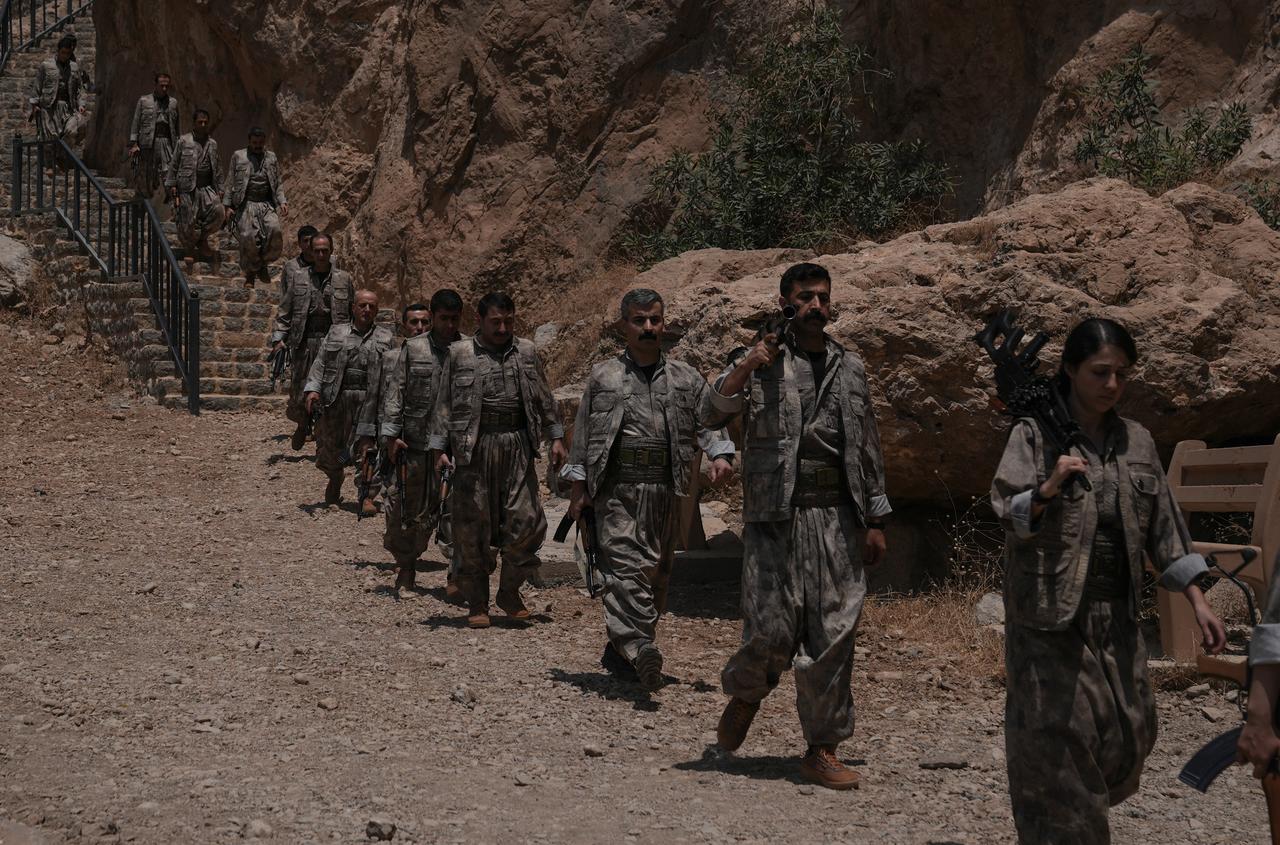 The first group of PKK terrorists lays down and destroys their weapons in Sulaymaniyah, northern Iraq on July 11, 2025. (AA Photo)