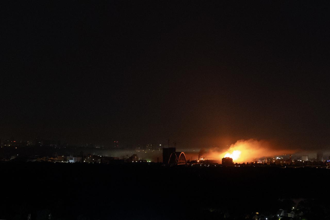An object burns on the ground as Ukrainian air defences deploy against Russian drones during a night mass drones and missiles strike in Kyiv on July 10, 2025. (AFP Photo)
