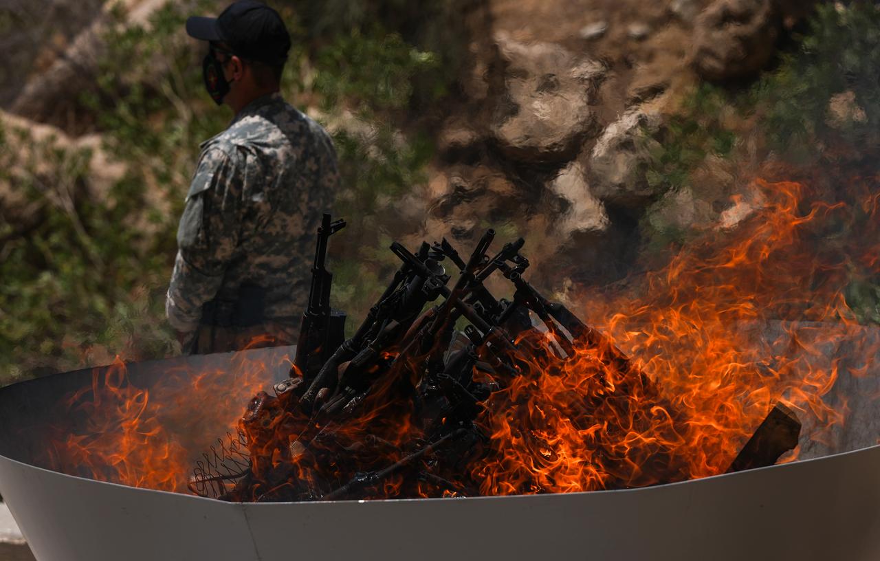 The first group of PKK terrorists lays down and destroys their weapons in Sulaymaniyah, northern Iraq on July 11, 2025. (AA Photo)