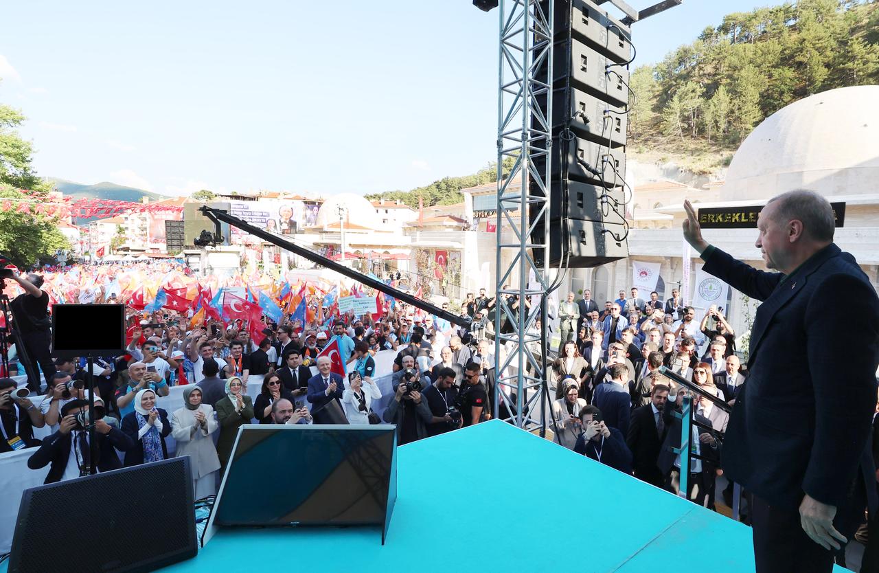 Erdogan greets people as he arrives for Mass Opening and Key Delivery Ceremony in Kizilcahamam district of Ankara, Türkiye on July 12, 2025. (AA Photo)