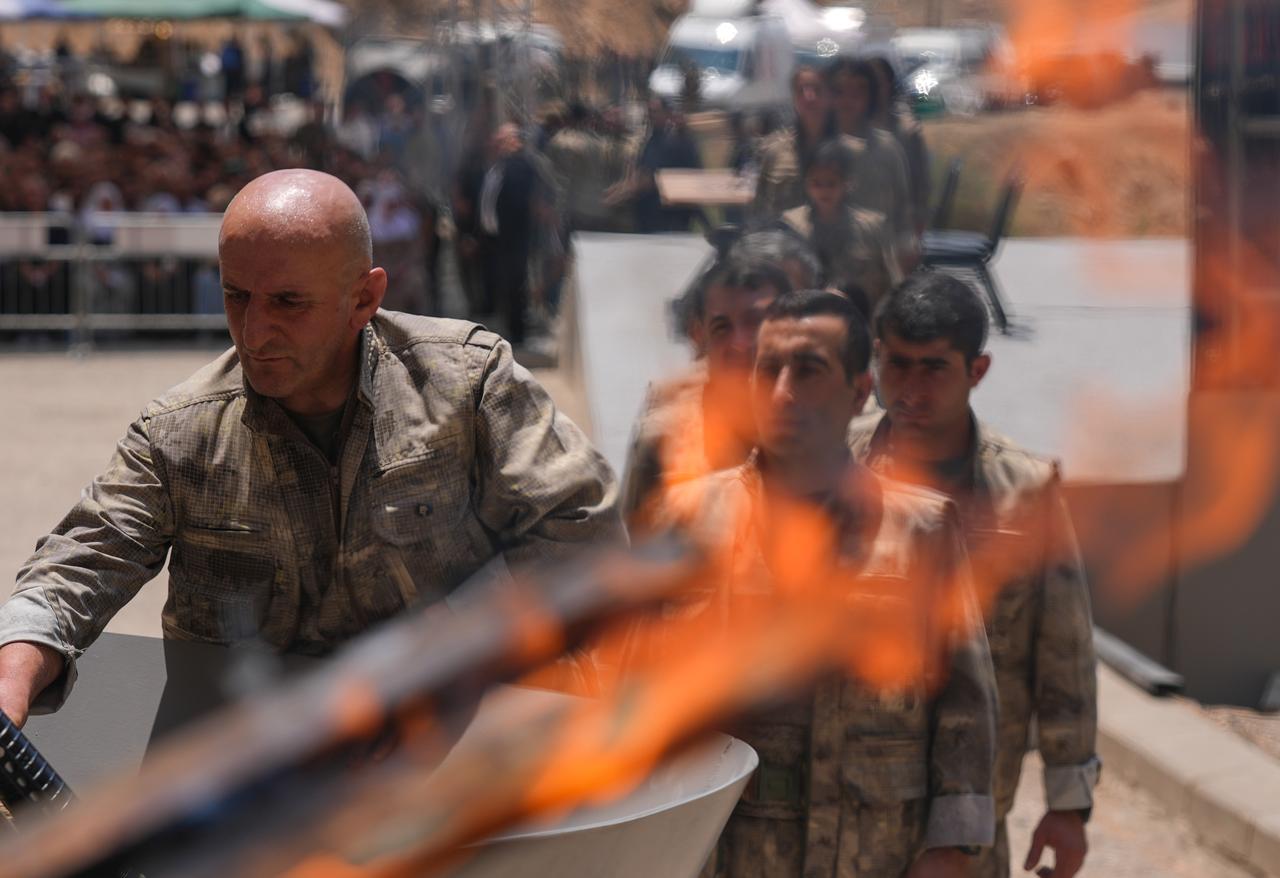 The first group of PKK terrorists lays down and destroys their weapons in Sulaymaniyah, northern Iraq on July 11, 2025. (AA Photo)