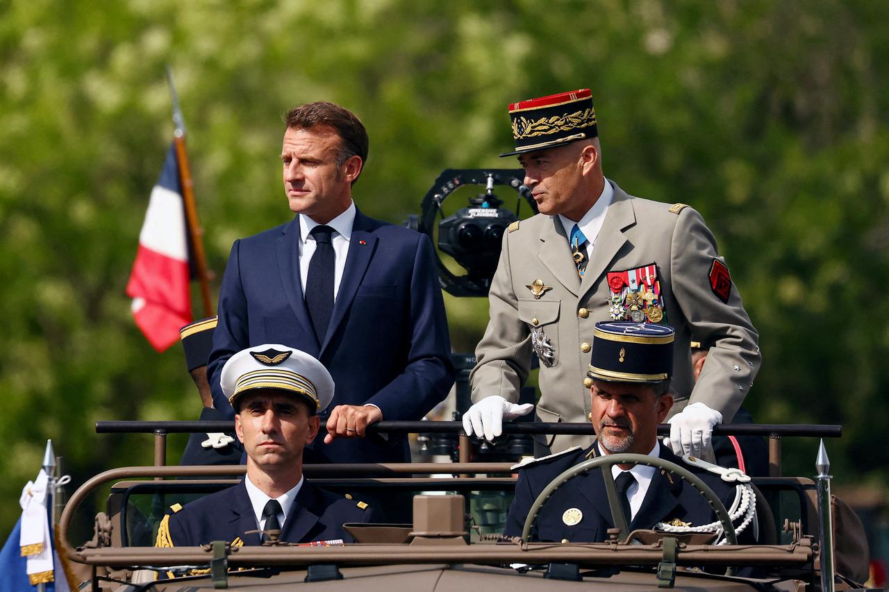 France's President Emmanuel Macron (Top L) and Chief of the Defense Staff General Thierry Burkhard (Top R) during annual Bastille Day military parade in Paris on July 14, 2025. (AFP Photo)
