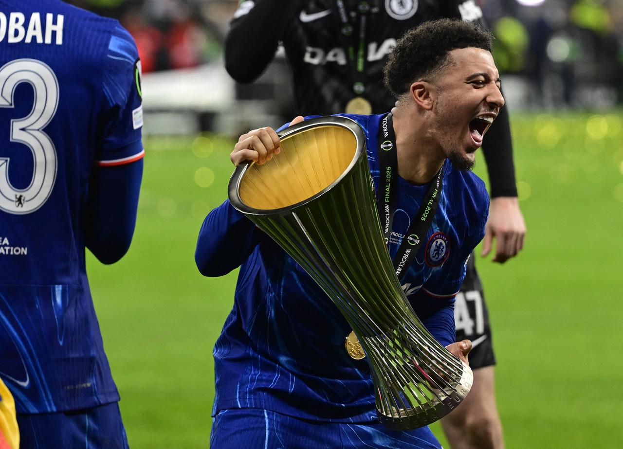 Chelsea's English midfielder #19 Jadon Sancho celebrates with the trophy after the UEFA Conference League final football match between Real Betis and Chelsea FC in Wroclaw, May 28, 2025. (AFP Photo)