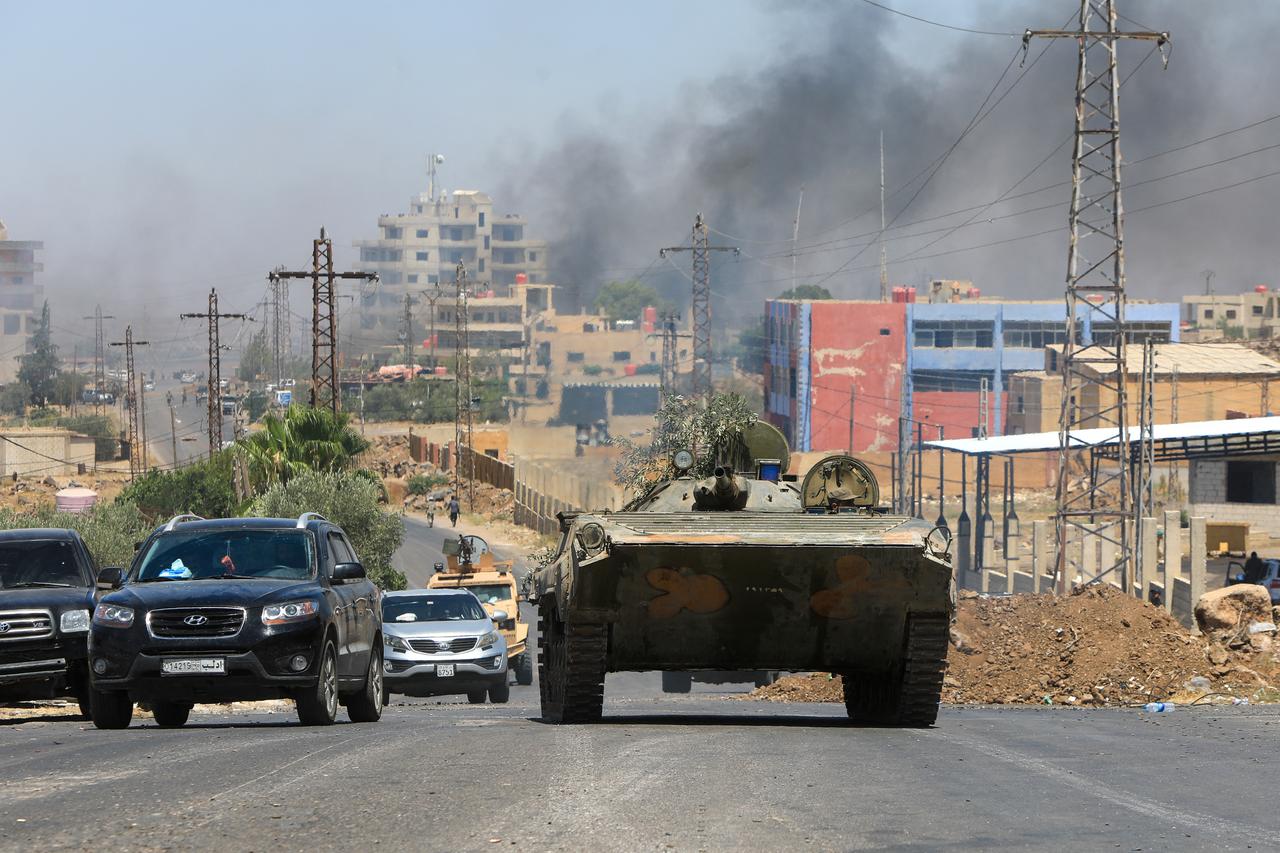 Members of Syria's security forces drive through the predominantly Druze city of Sweida, Syria on July 15, 2025. (AFP Photo)
