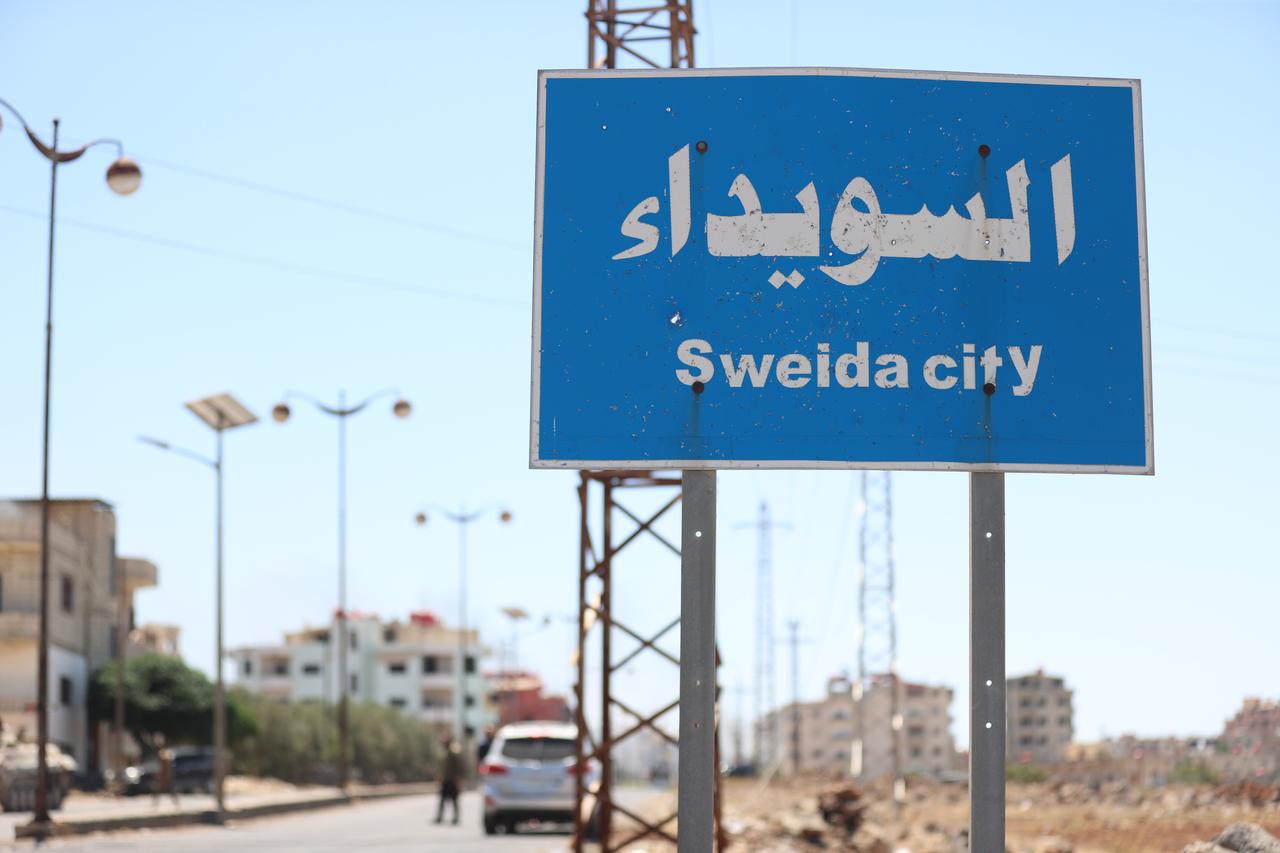 A city sign in the center of Sweida, in Syria after Israeli warplanes struck on July 15, 2025. (AA Photo)