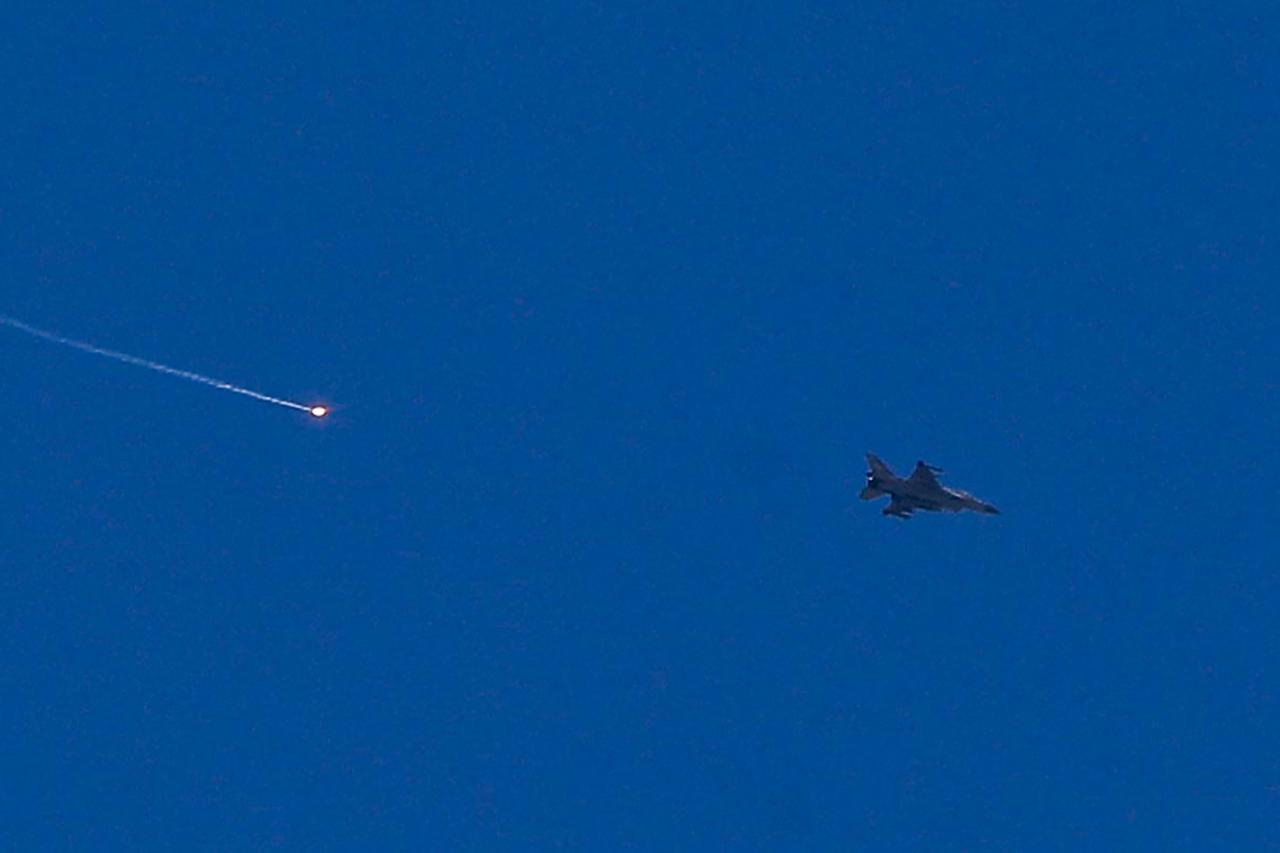 An Israeli fighter aircraft fires a flare as it flies over the predominantly Druze city of Sweida, Syria on July 15, 2025. (AFP Photo)