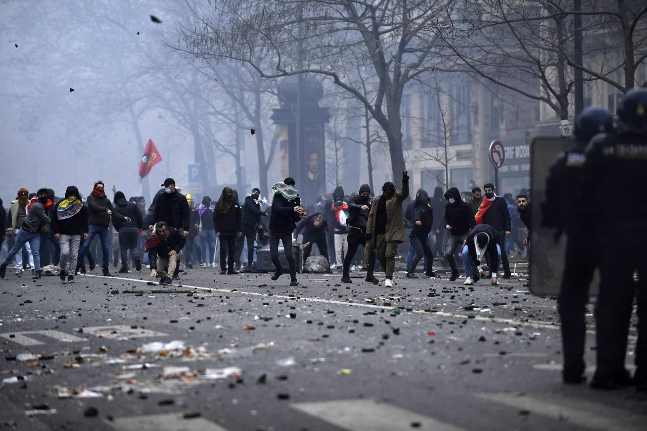 Terrorist group PKK's supporters face French riot police in Paris, France on Dec. 24, 2022. (AFP Photo)