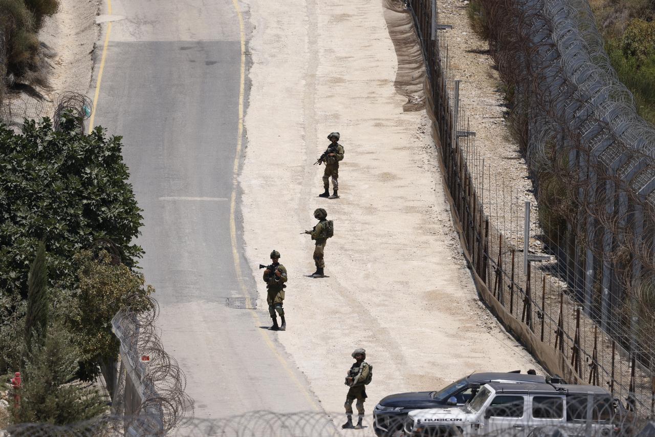 Isaeli troops stand guard on the dividing line between the Israeli-annexed Golan Heights and the Syrian side, near Majdal Shams on July 16, 2025. (AFP Photo)