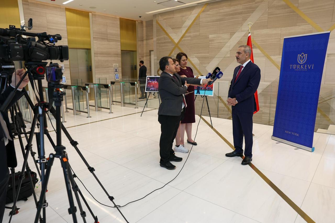 Turkish Foreign Minister Hakan Fidan makes evaluations on the issues about Cyprus and Israeli attacks over Syria to the press members within the Extended Informal Meeting on Cyprus in New York, United States on July 16, 2025. (Turkish Foreign Ministry / AA Photo)