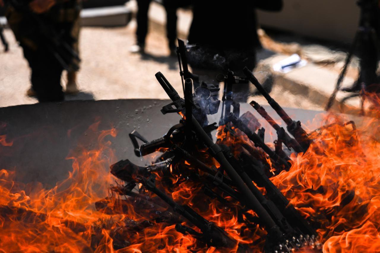 The first group of PKK terrorists lays down and destroys their weapons in Sulaymaniyah, northern Iraq on July 11, 2025. (AA Photo)