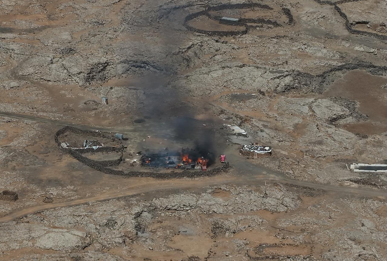 An aerial view of homes belonging to Bedouin Arabs are seen set on fire by members of the Druze community in Sweida, Syria on July 17, 2025. (AA Photo)