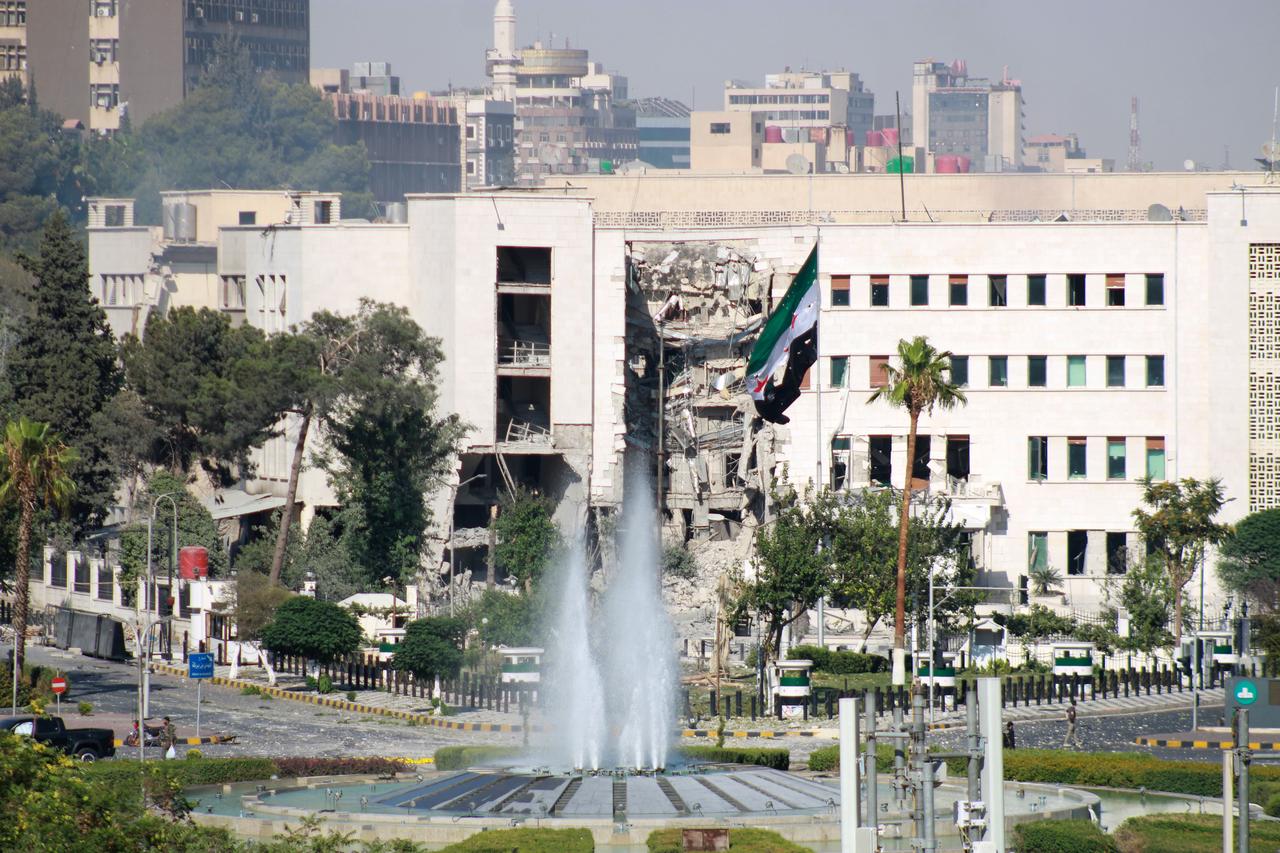 Emergency services and security forces arrive and set up a security perimeter following an Israeli airstrike targeting the entrance of the Syrian army’s General Staff Complex in Damascus, Syria, on July 16, 2025. (AA Photo)