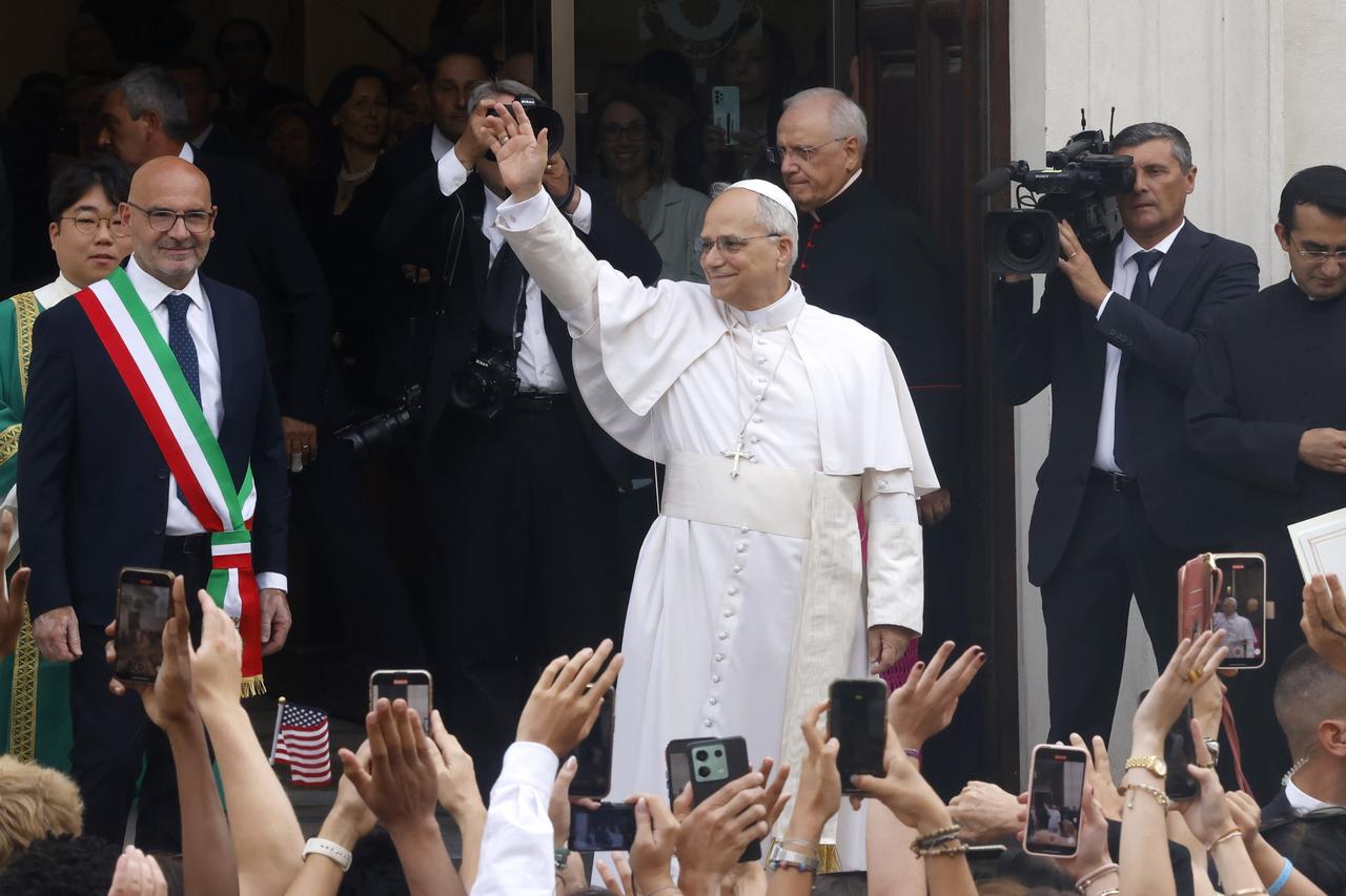 Pope Leo XIV greets the faithful as he arrives to celebrate a Mass at the church of St. Thomas of Villanova in Castel Gandolfo, Italy, on July 13, 2025. (AA Photo)