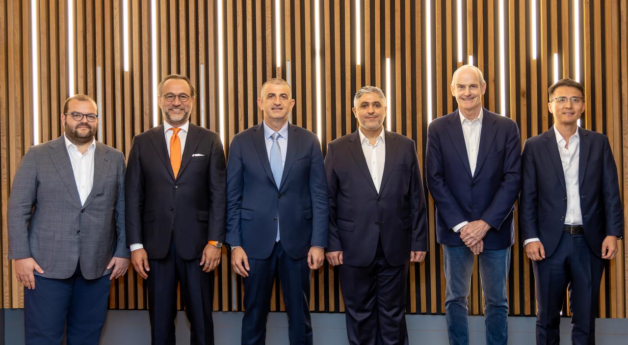 Executives including Erdem Inan (far left), Caglayan Cetin (second from left), Haluk Bayraktar (third from left), Mansour AlMulla (center), Michael Evans (second from right), and Yi Zhou (far right) attend the MoU signing ceremony in Istanbul, Türkiye, July 16, 2025. (AA Photo)
