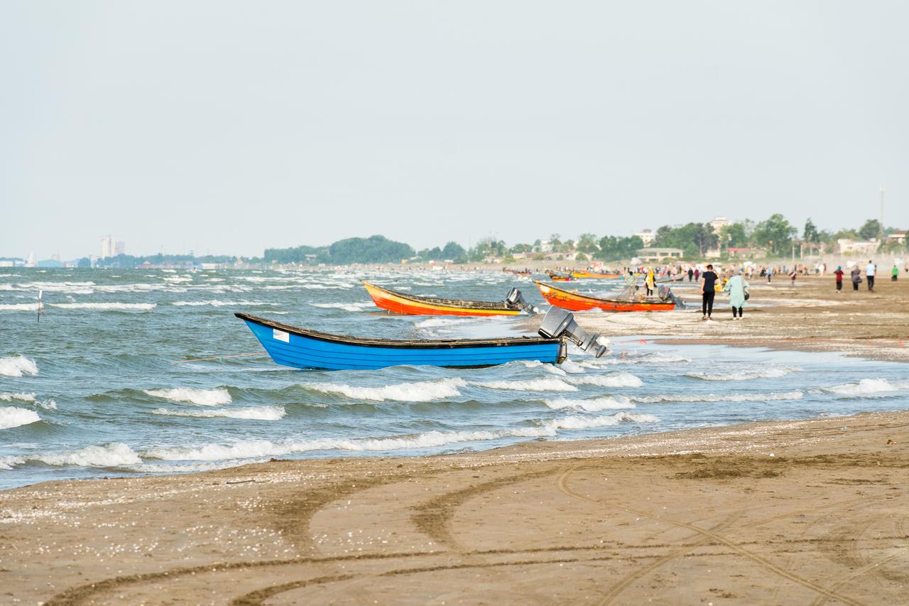 Traditional Iranian colorful wooden motor boats on Caspian Sea shore in Bandar-e Anzali, Gilan, Iran, accessed July 17, 2025. (Adobe Stock Photo)