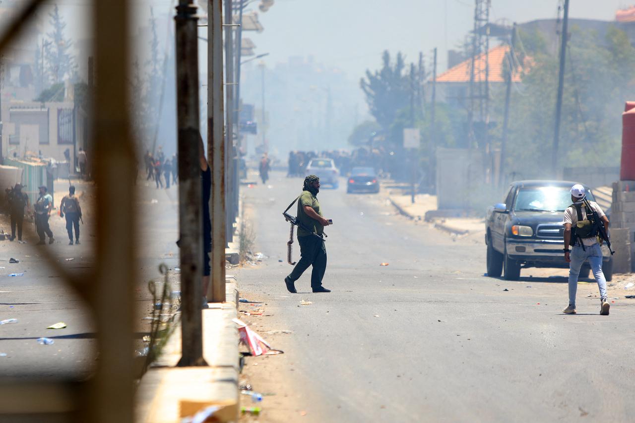 Bedouin tribal gunmen remain on alert against Druze fighters, despite an announcement by the Syrian President of an  immediate cease-fire  in a neighbourhood in Sweida Syria on July 19, 2025. (AFP Photo)
