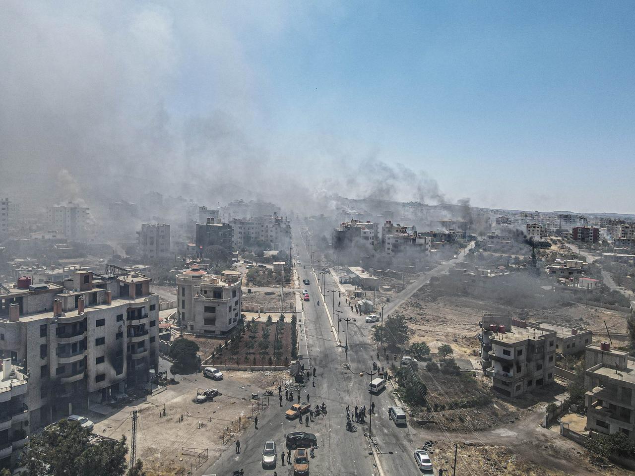Smoke rises as clashes continue between Bedouin Arabs and some Druze armed groups in Sweida, Syria on July 19, 2025. (AA Photo)