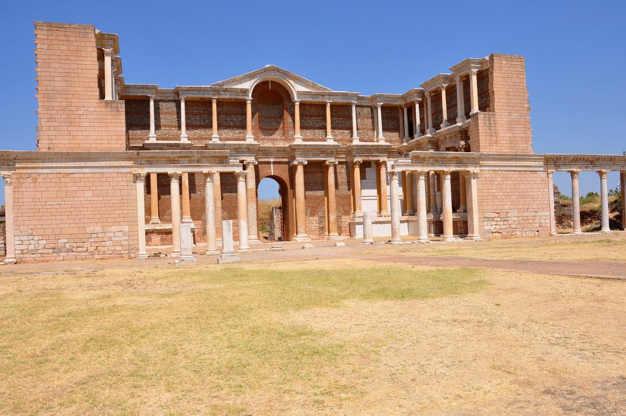 The restored Roman-era gymnasium façade stands at the heart of the ancient city of Sardis, in Manisa, Türkiye, July 13, 2025. (AA Photo)
