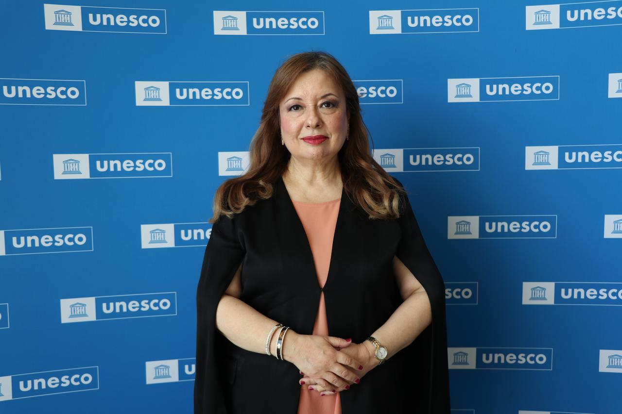 Ambassador Gulnur Aybet poses in front of the UNESCO backdrop after the inclusion of Sardis and the Bin Tepe tumuli in the World Heritage List, Paris, France, July 12, 2025. (AA Photo)