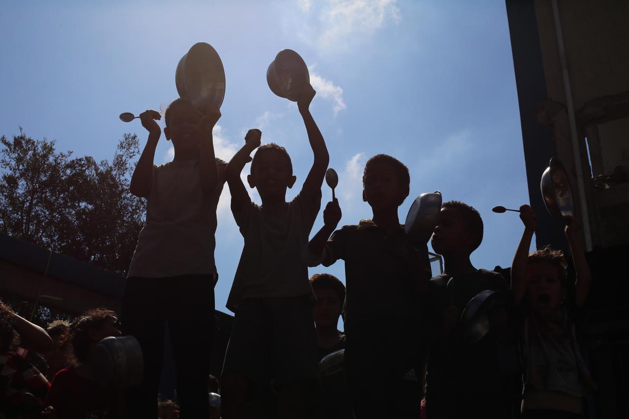 Displaced Palestinians during a protest calling for an immediate end to the ongoing attacks and urgent delivery of humanitarian aid in Gaza Strip, on July 20, 2025. (AA Photo)