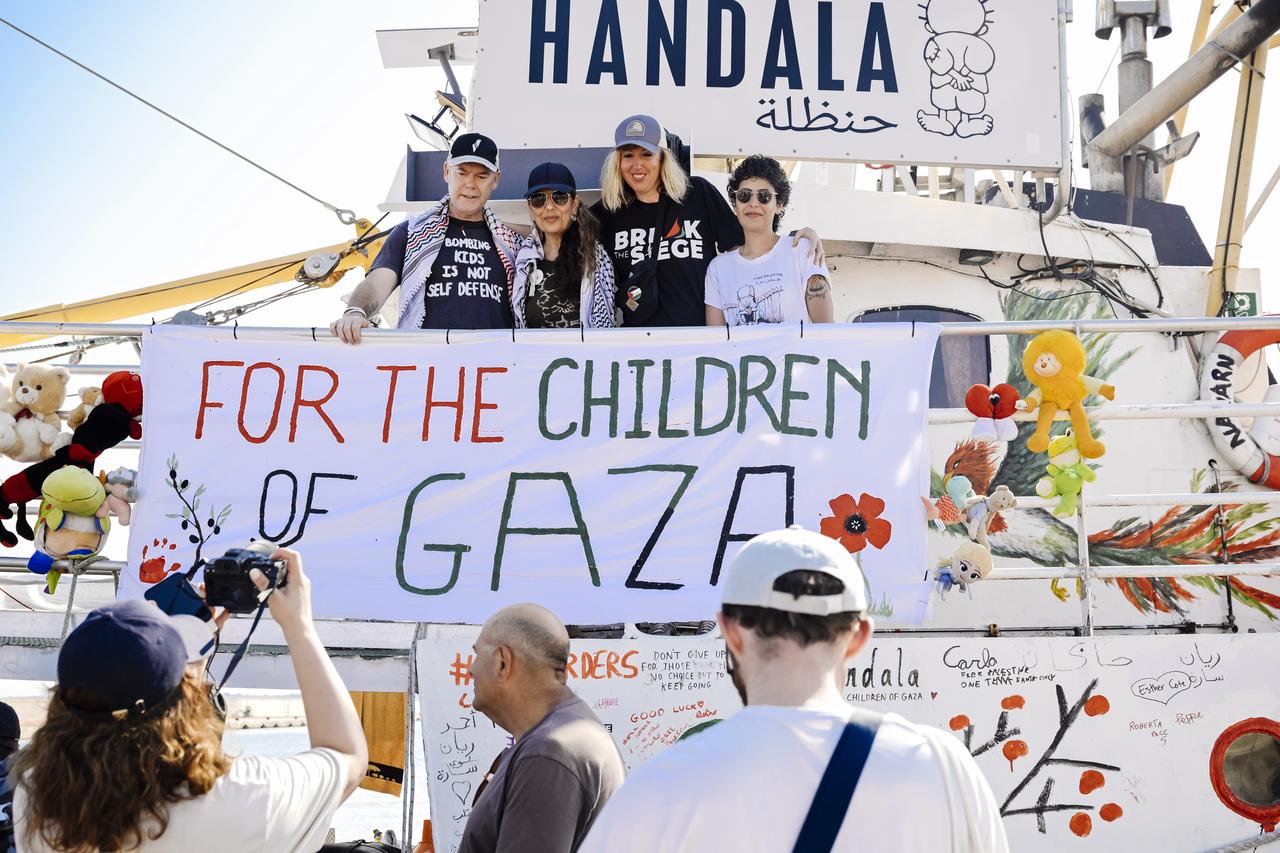 People greeting the crew after a press point, the vessel "Handala" of Freedom Flotilla Coalition departed from Gallipoli Port, in Italy, on 20 July 2025. (AA Photo)