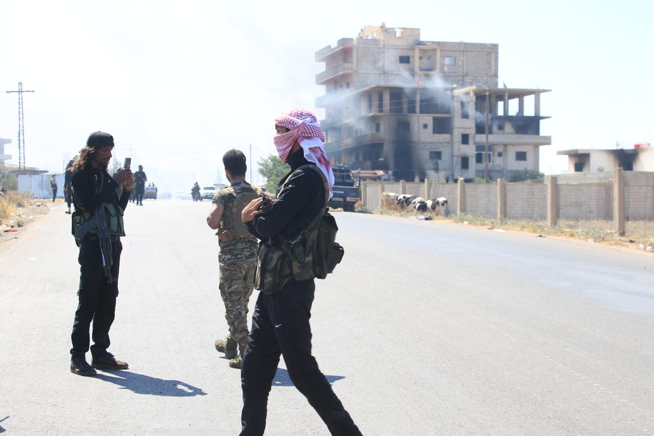 Armed groups are seen as clashes continue between Bedouin Arabs and some Druze armed groups in Syria’s southern Sweida province on July 19, 2025. (AA Photo)