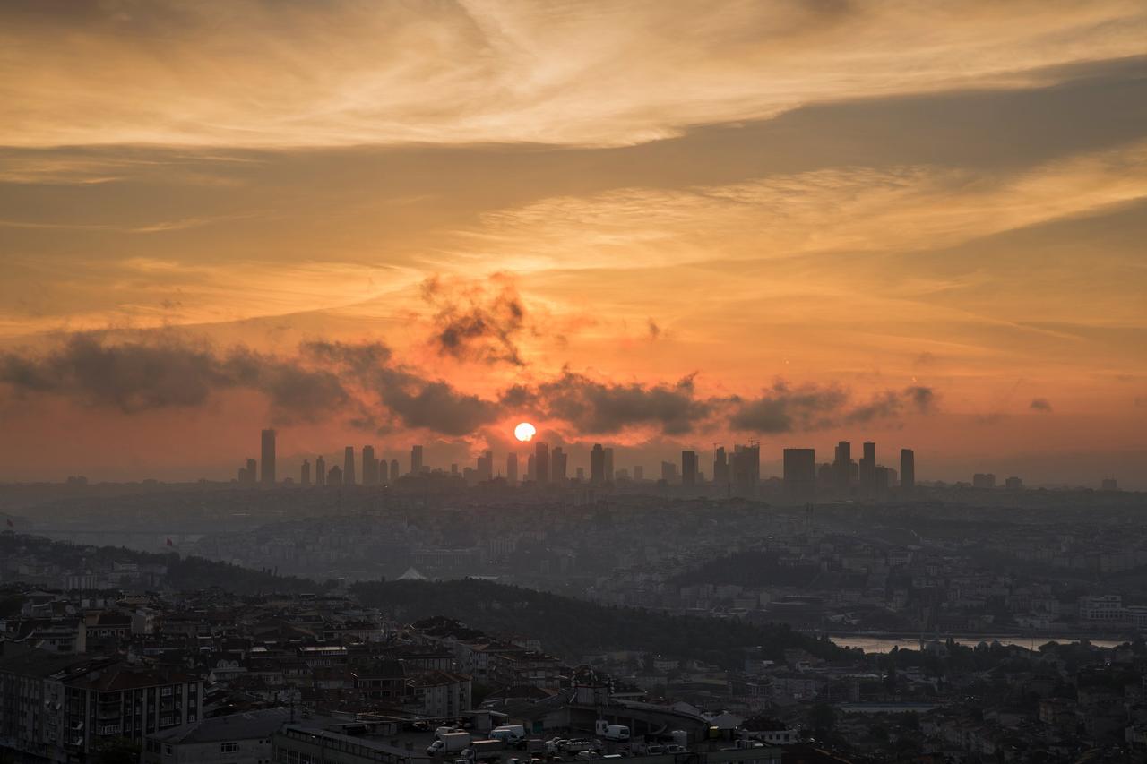 View of Istanbul during sunset with skyscrapers and over populated urban architecture. (Adobe Stock Photo)