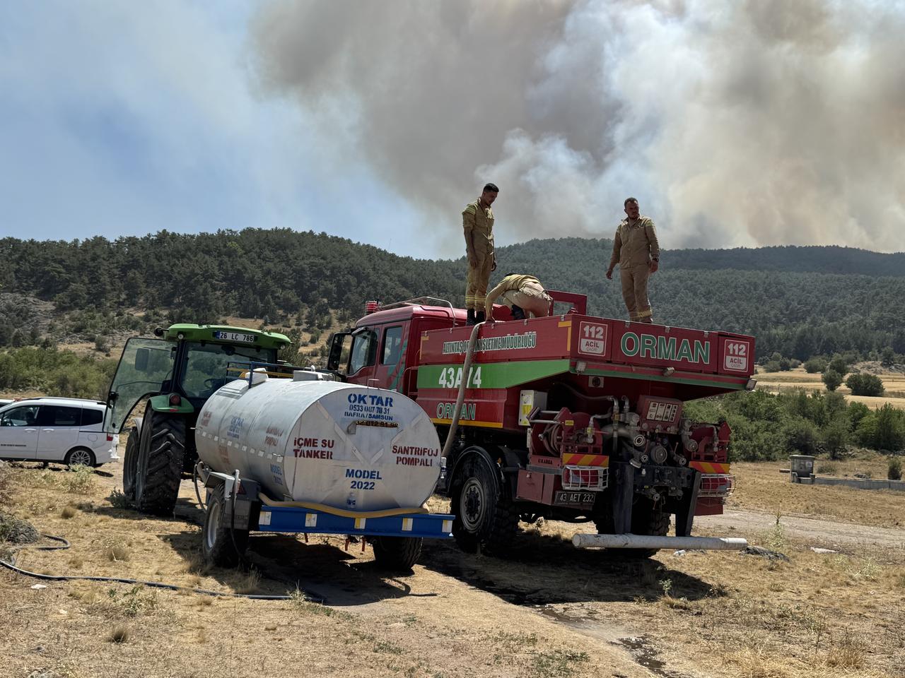 Smoke rises from burning trees while air and land intervention continues against the fire that broke out in the forest area in Seyitgazi district of Eskisehir, Türkiye on July 22, 2025. (AA Photo)