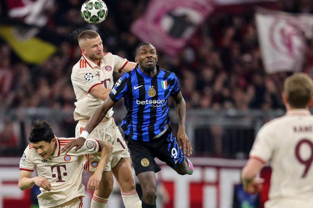 Bayern Munich's Eric Dier (#15) and Kim Min-Jae (#3) challenge Inter Milan's Marcus Thuram (#9) for a header during the UEFA Champions League quarterfinal first leg match, Munich, Germany, April 8, 2025. (AFP Photo)