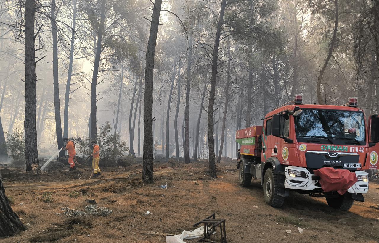 Efforts underway to contain a wildfire in a forested area in Aksu district of Antalya, Türkiye, July 25, 2025. (AA Photo)