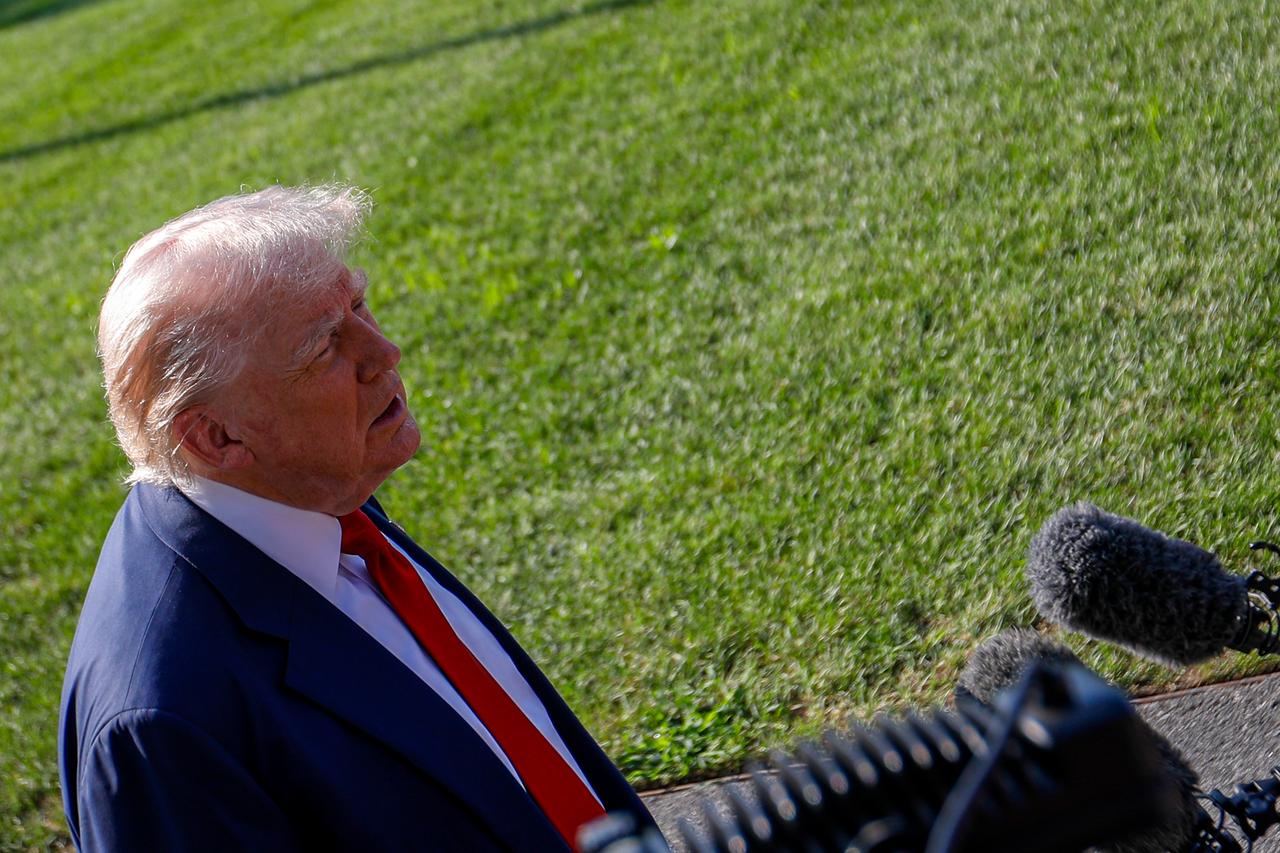 U.S. President Donald Trump speaks to members of the media before departing the White House en route to Turnberry, Scotland in Washington DC, July 25, 2025. (AA Photo)