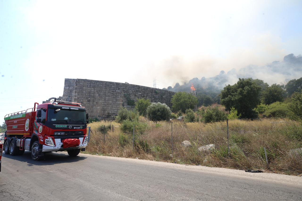 Flames surround the theater structure of the ancient city of Perge in Antalya’s Aksu district after a forest fire broke out, Türkiye, July 25, 2025. (AA Photo)