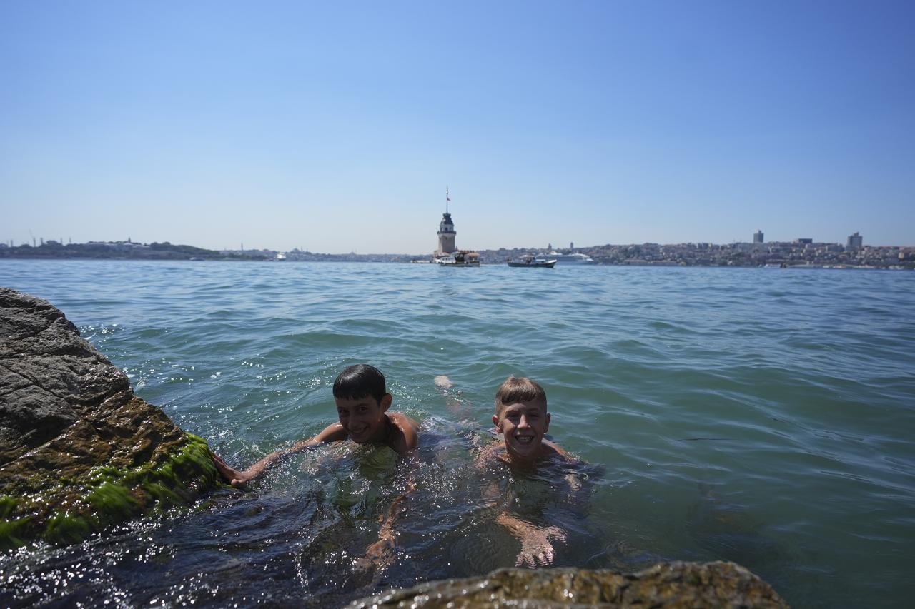 Children swim in the Marmara Sea to escape the sweltering heat at Salacak coast in Uskudar district of Istanbul, Türkiye, on July 21, 2025. (AA Photo)