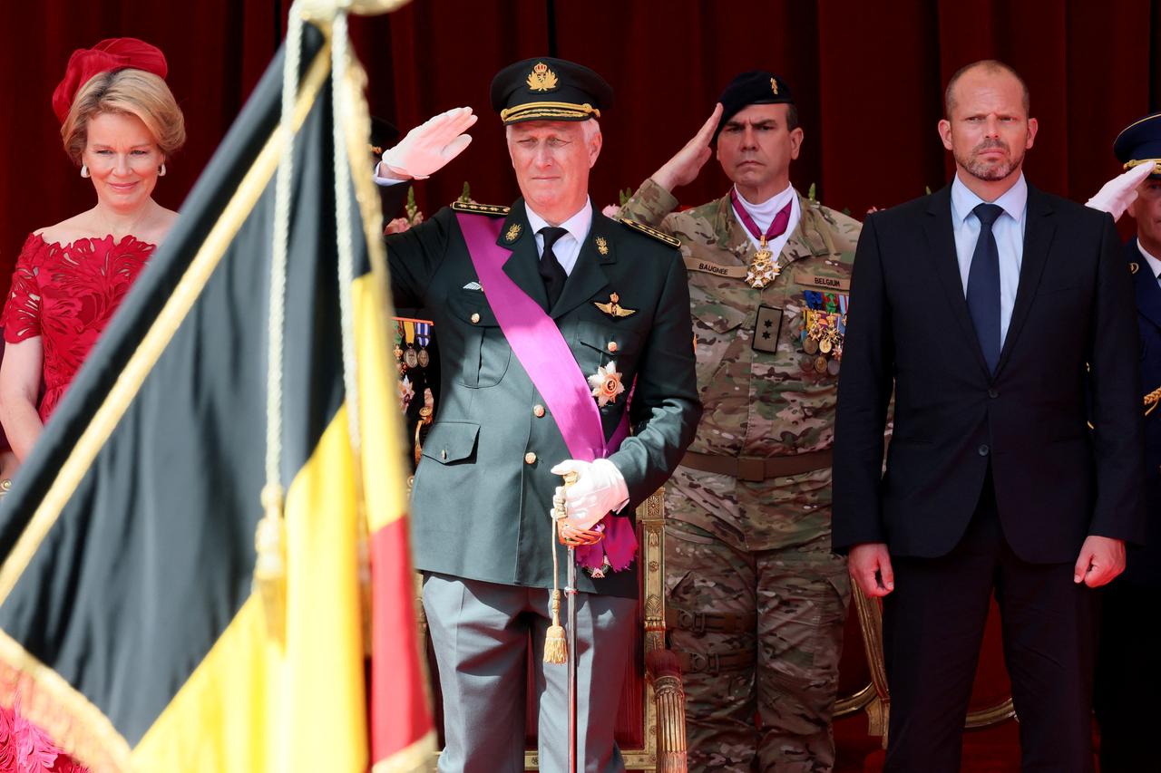 Queen Mathilde of Belgium (L), King Philippe of Belgium (C-L) and Belgium's Defence Minister Theo Francken (R) at the military and civilian parade in Brussels on July 21, 2025. (AFP Photo)