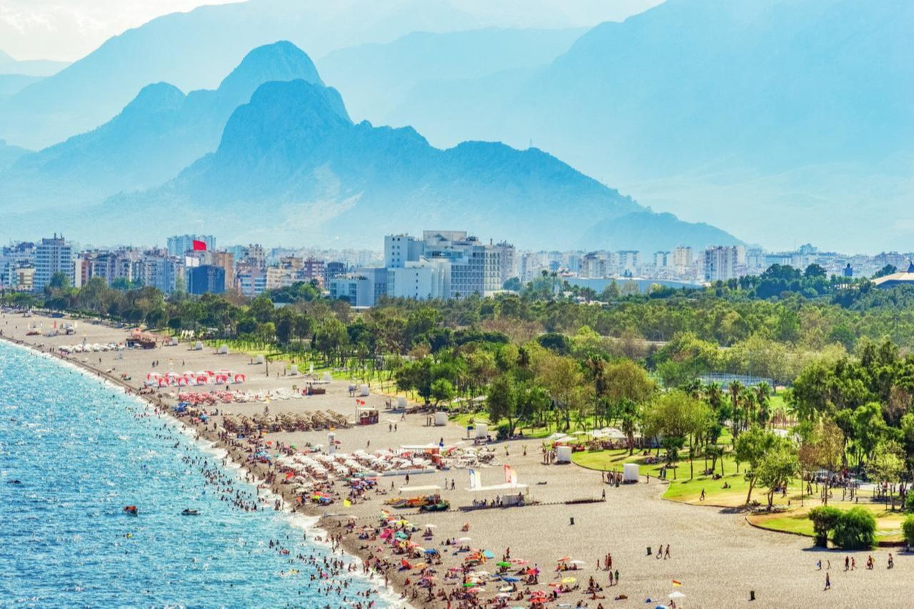 People are seen on a beach in the Mediterranean resort city of Antalya, Türkiye, August 18, 2019. (iStock Photo)