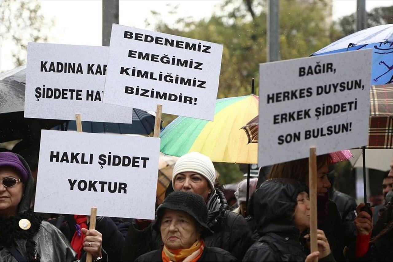 Women protest against gender-based violence, holding signs that read “There is no justifiable violence” in Türkiye. (AA Photo)