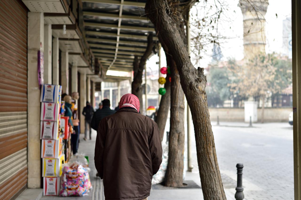 A Syrian man walks alone through a quiet street in Gaziantep, Türkiye. (Adobe Stock Photo)