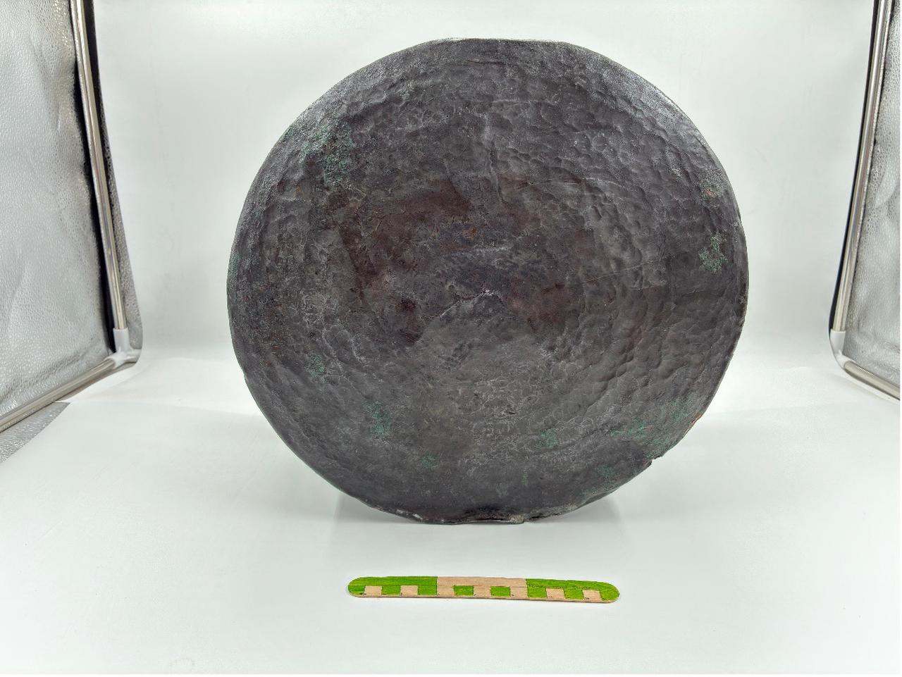 A 1,400-year-old bronze cauldron, believed to date back to the Roman period, was discovered during excavations at the ancient city of Pergamon in the Bergama district of Izmir, Türkiye, July 27, 2025. (AA Photo)