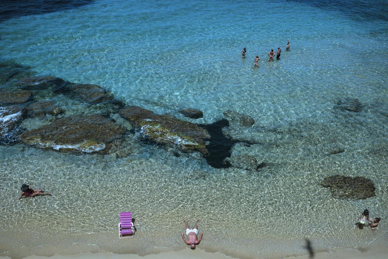 People swim at La Purita beach in Gallipoli, Italy, July 19, 2025. (AA Photo)